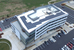 Commercial building in Springfield, MO with solar panels on its flat roof