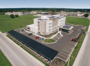 Best Western in Bolivar MO with a solar carport mount and solar panels on the roof